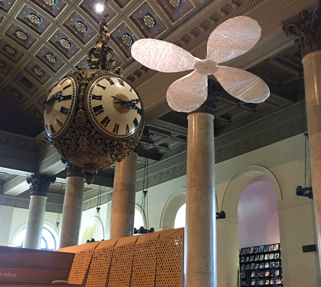 Large flower sculpture hanging from the ceiling of the RISD Library