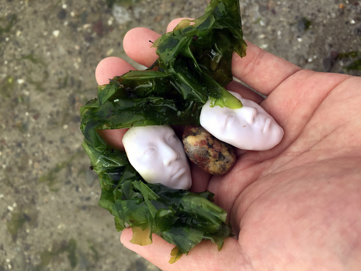 tiny skulls in a man's hand