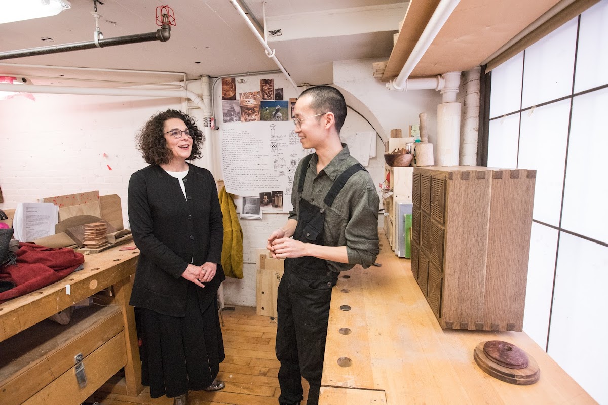 Justin Seow 18 FD chats in the furniture studio with President Rosanne Somerson 76 ID