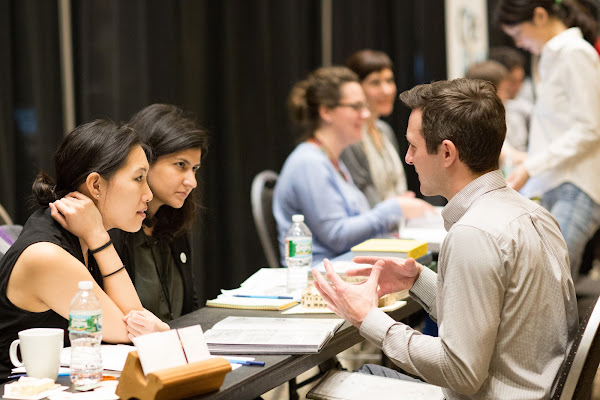 Students in conversations with professionals at the Design Portfolio Review