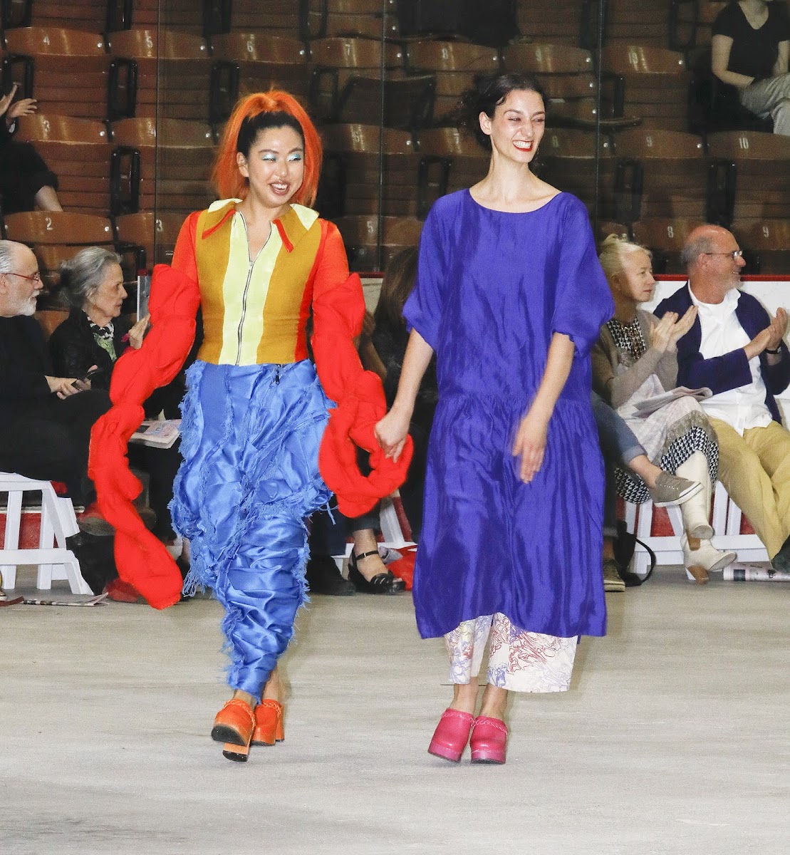 Designer Isabel Hajian 19 AP takes a celebratory runway walk with one of her models