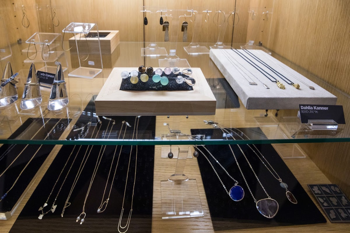 Jewelry made by RISD alumni in display case in the RISD Store