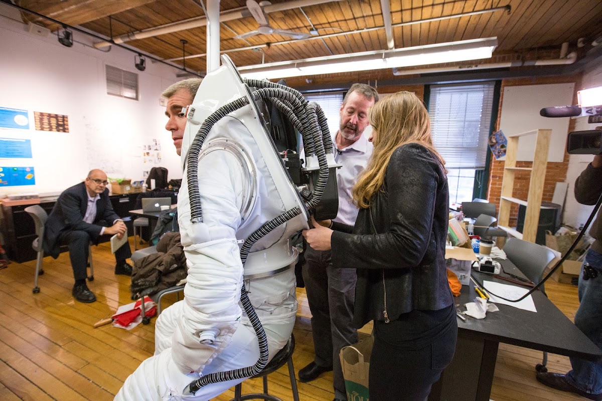 Michael Lye 96 ID and Kasia Matlak MID 17 talking about the suit, with HI-SEAS crew member Andrzej Stewart wearing it