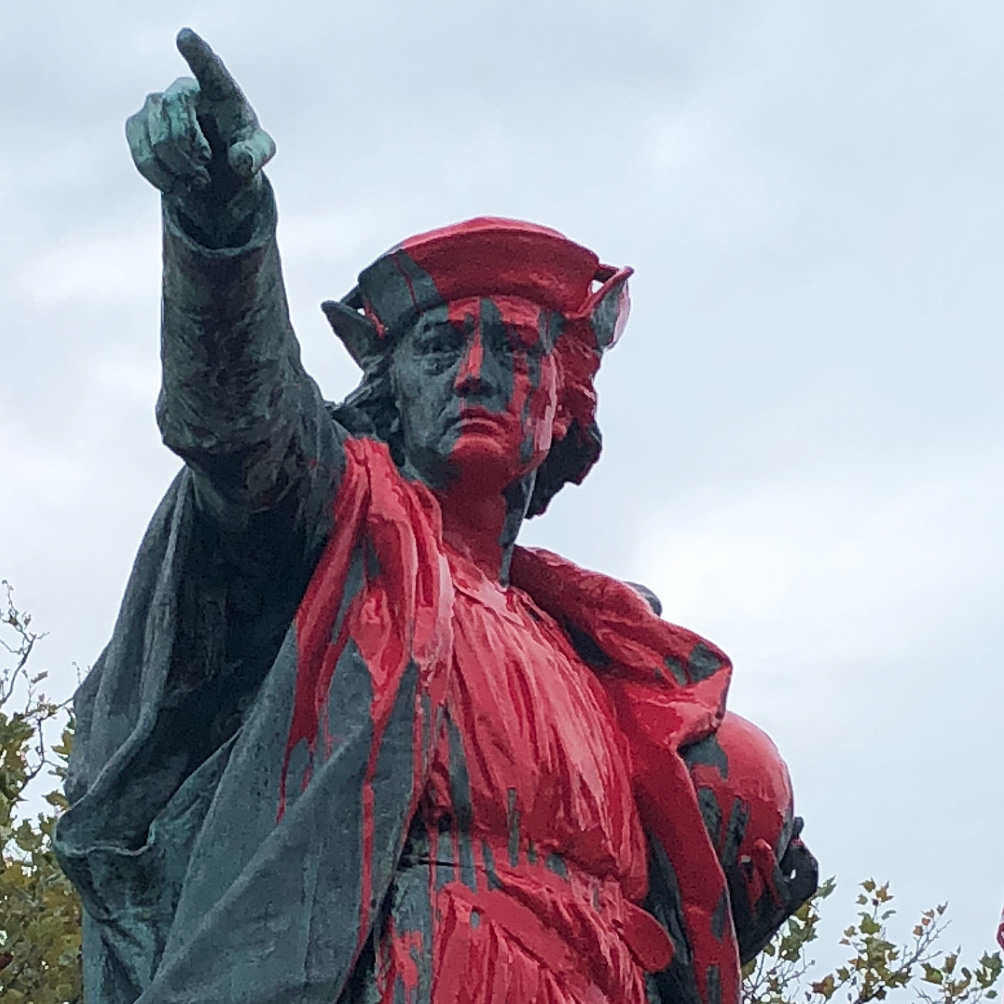 A red paint splattered Christopher Columbus statue in Providence