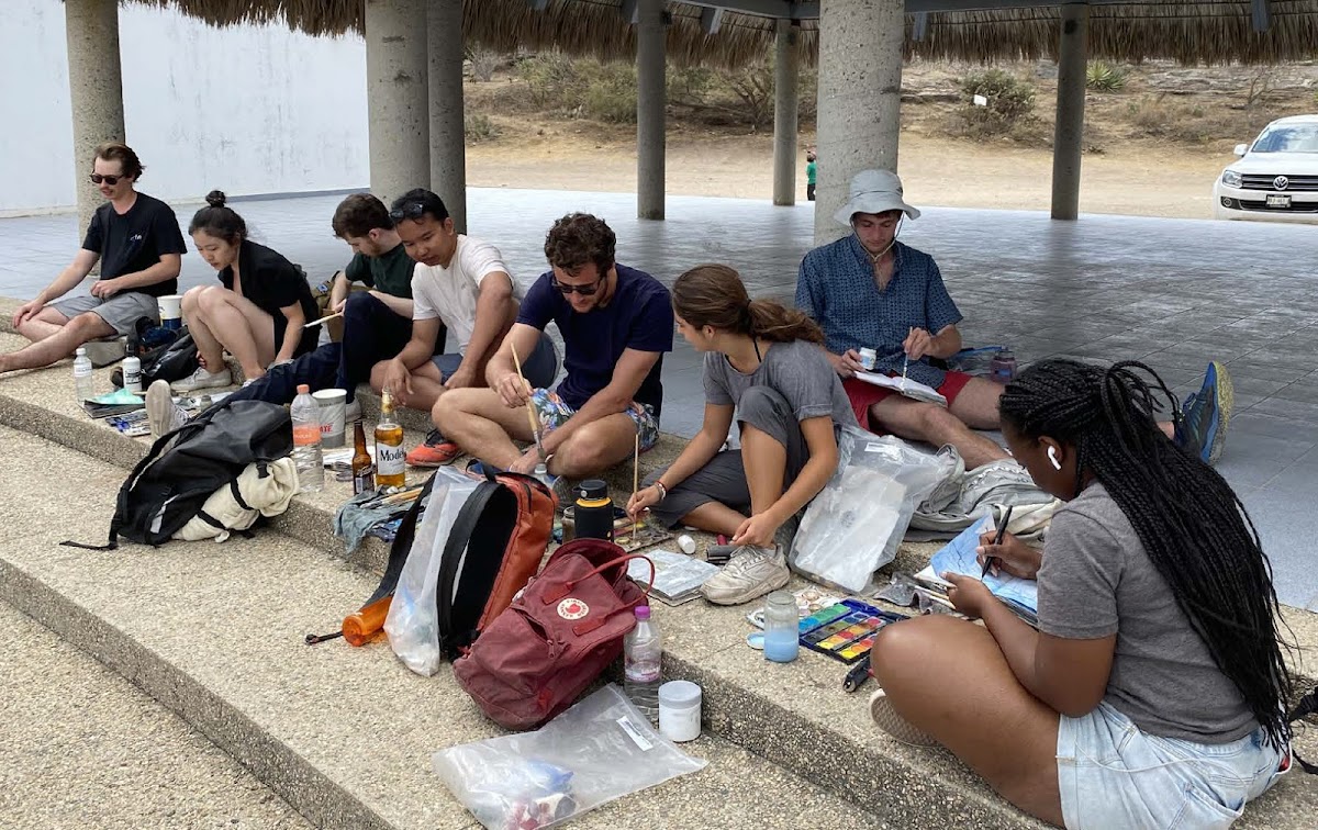 Students all sketching together outside