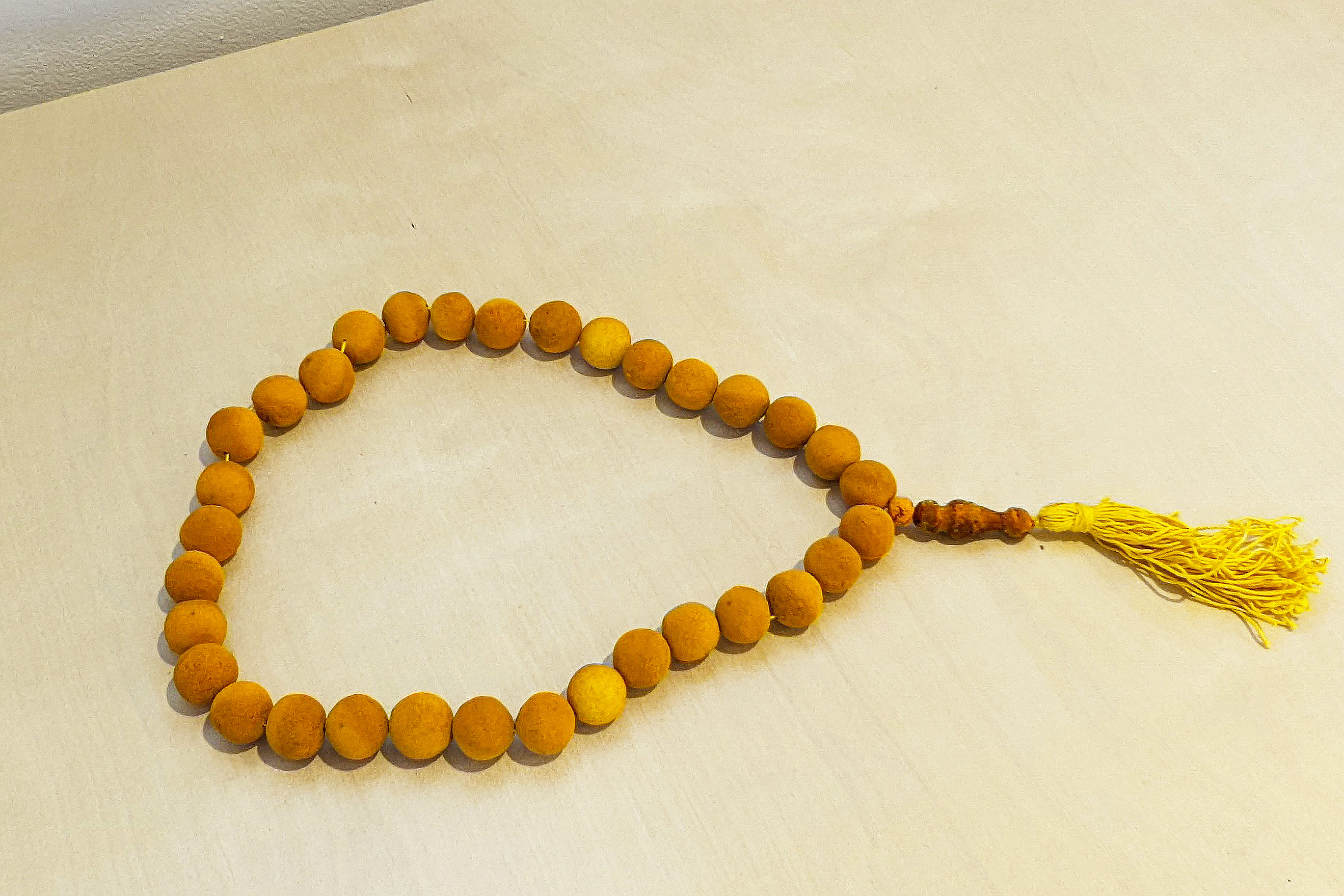prayer beads carved out of turmeric