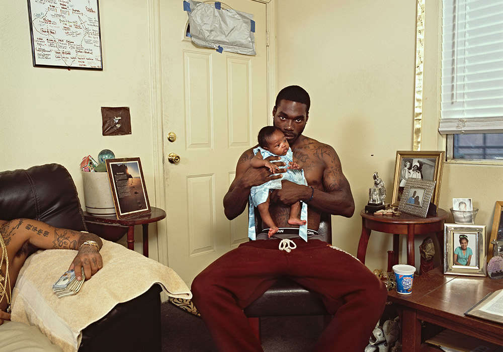 Photograph of man holding baby, Sons of Cush by Deana Lawson MFA 04 PH