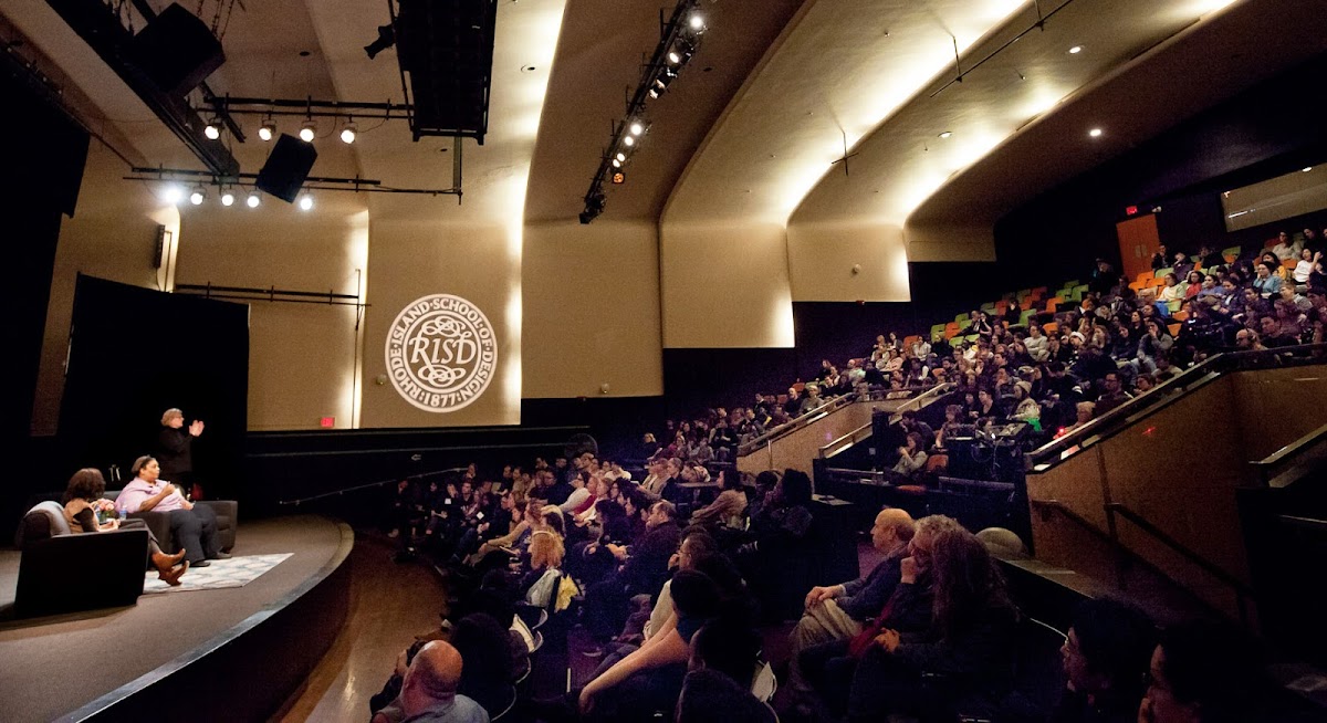 Writer/activist Roxane Gay speaking to large crowd in the RISD Auditorium