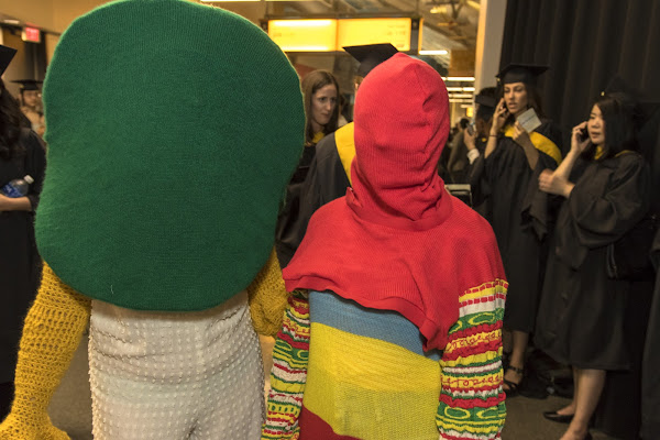 Two people in costumes that cover their faces