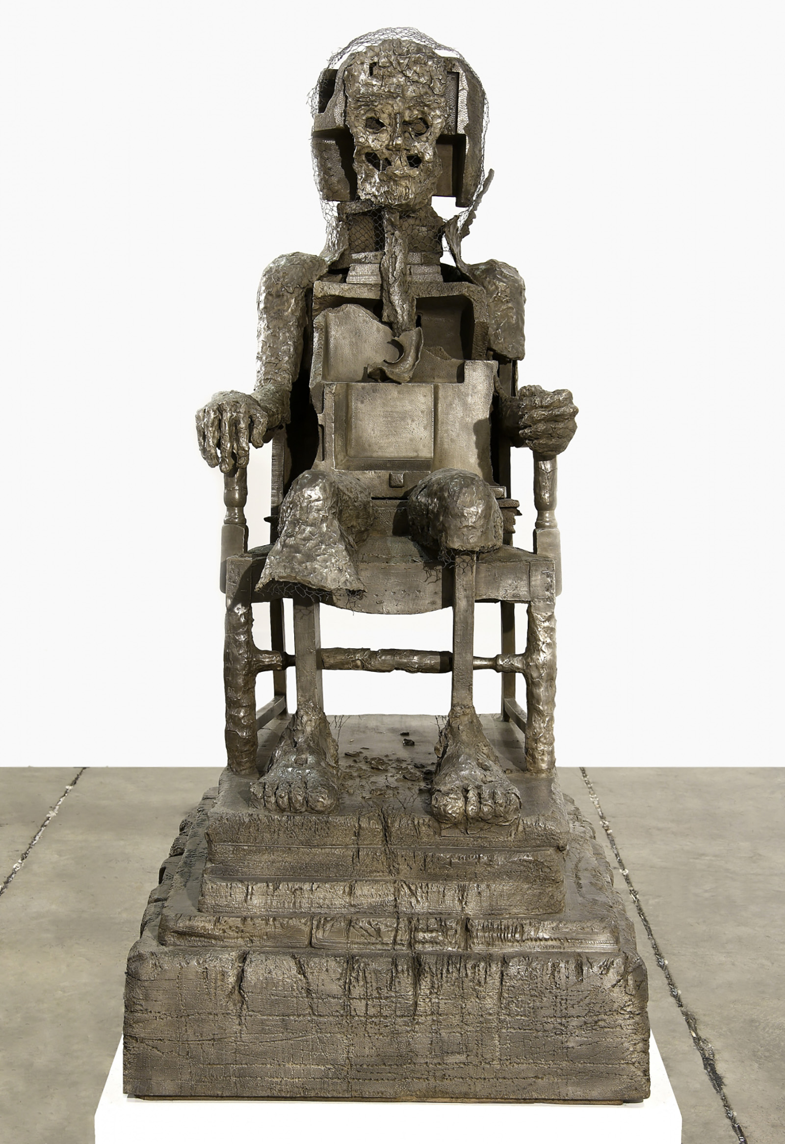 seated figure in bronze by Bhabha