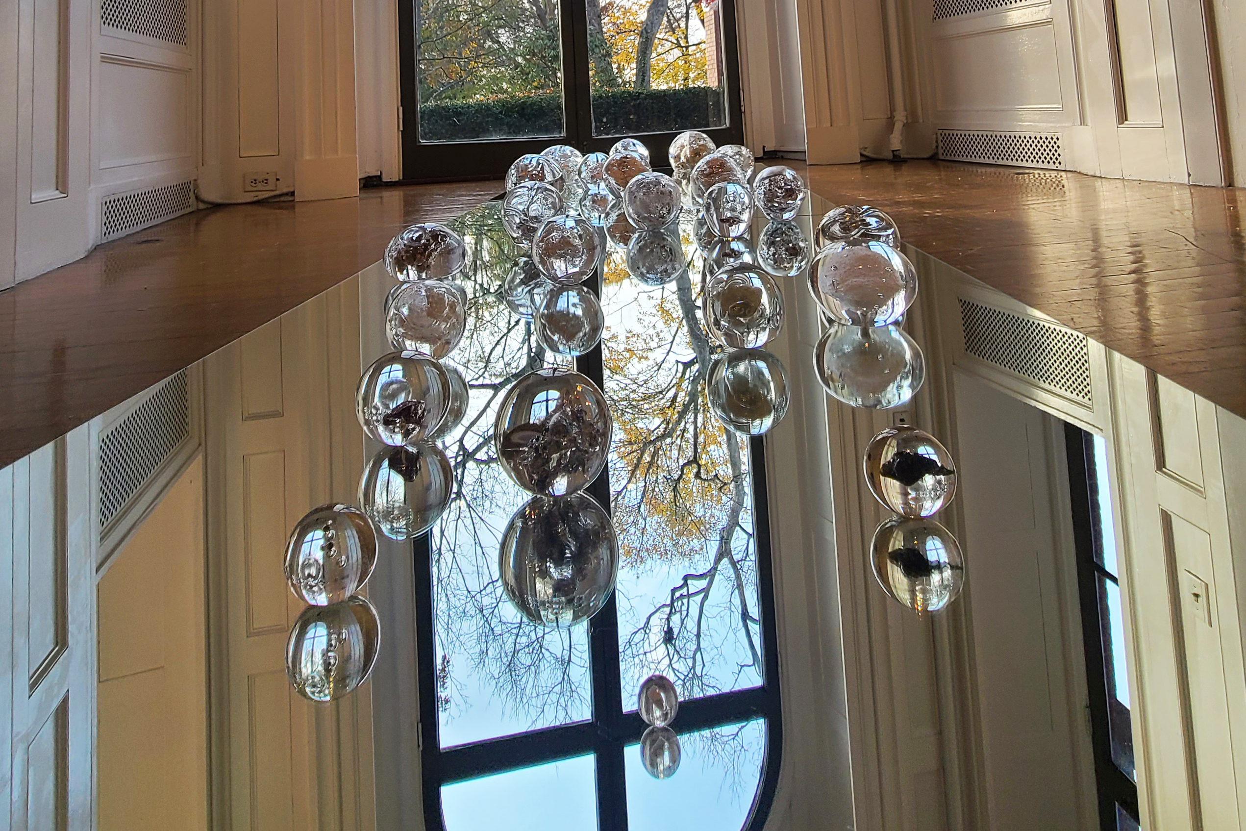 clear glass orbs on view in Woods-Gerry gallery 