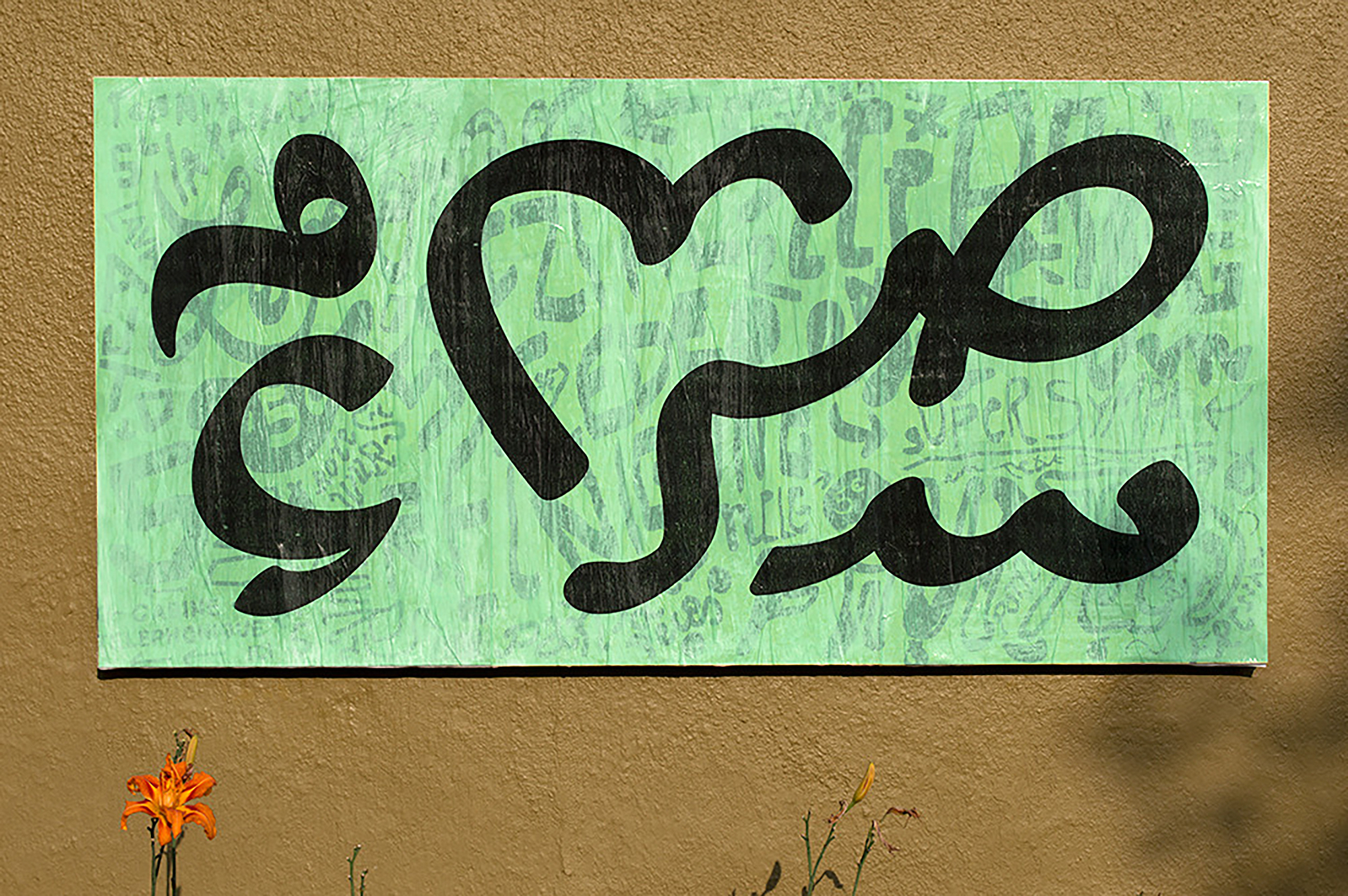 Arabic writing on a green tapestry