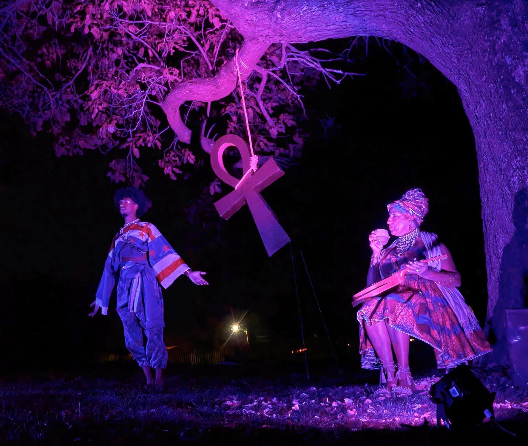 photo of performance piece scene under tree