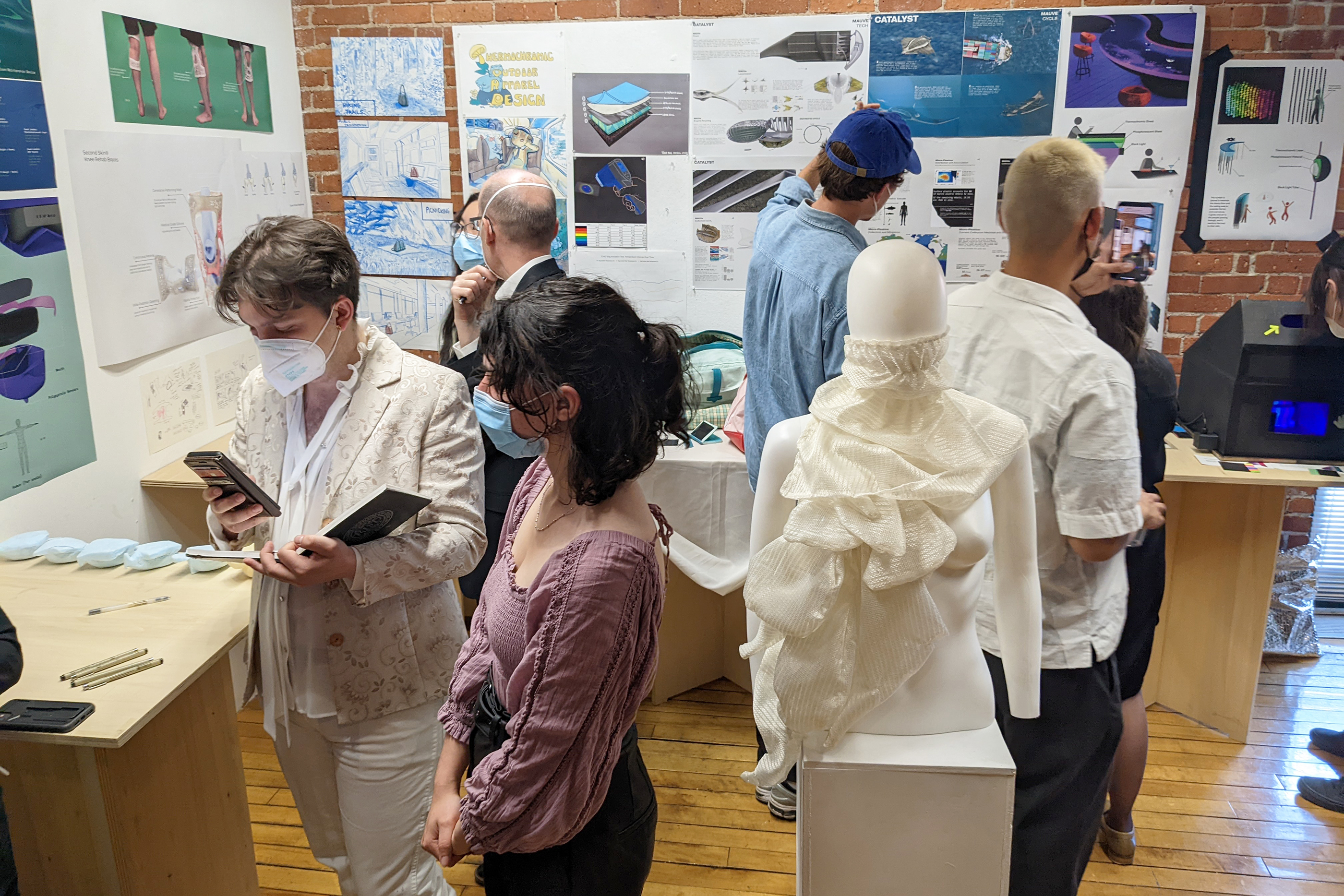 students and critics crowd into ID exhibition space