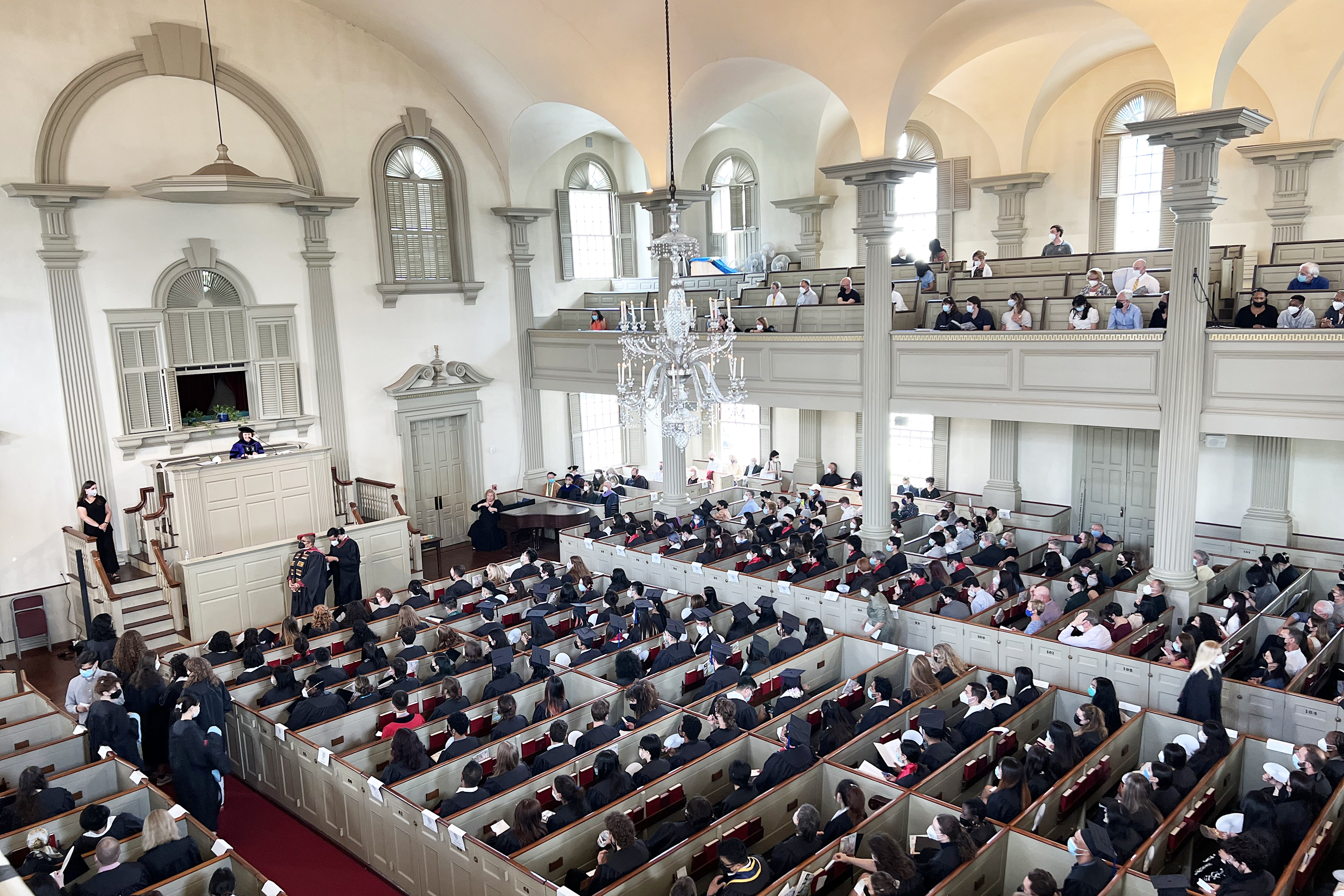 grad hooding ceremony inside the First Baptist Church