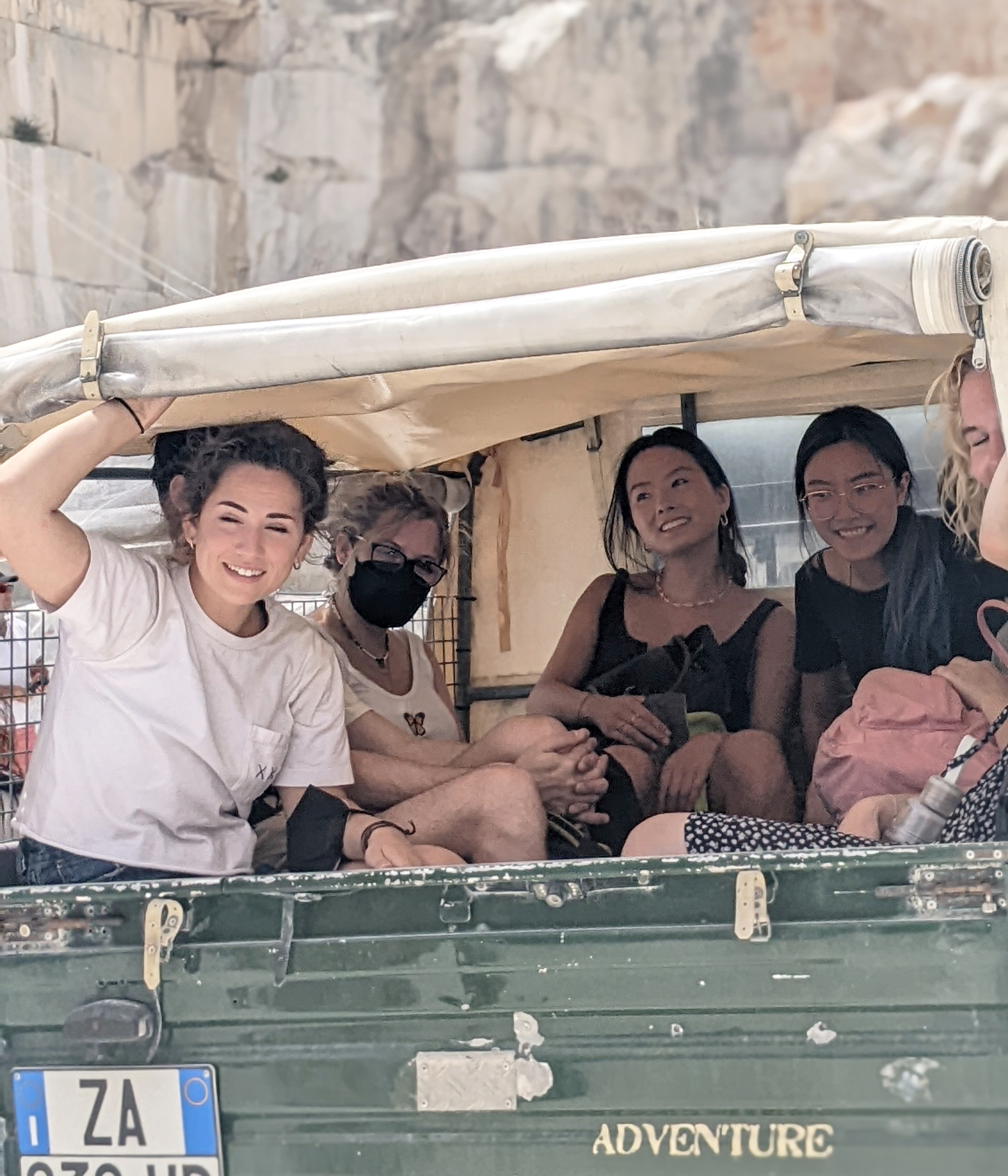 students in the back of a jeep at the marble quarry