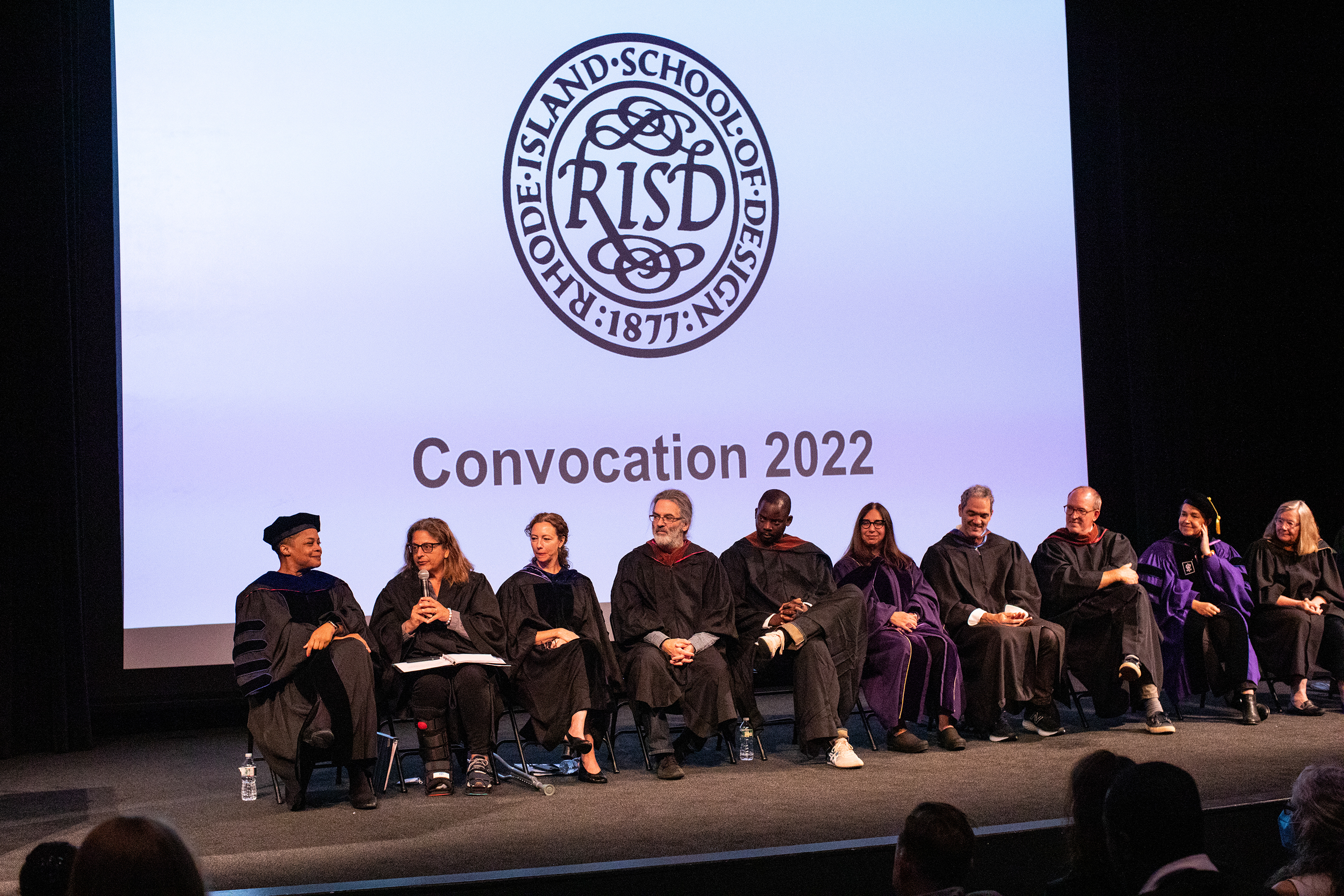 President Williams, Provost Anais Missakian and deans sit on the stage during convocation