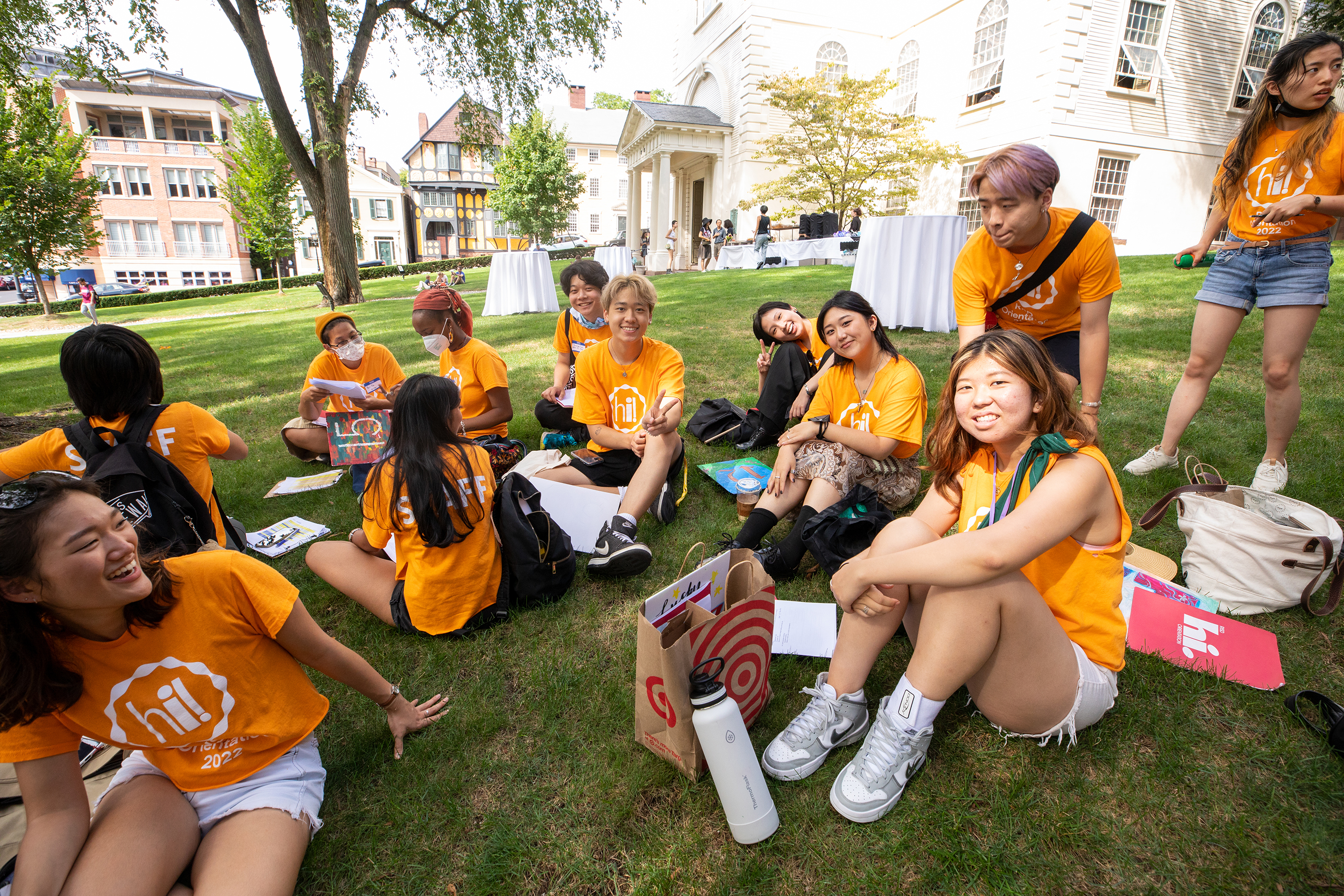 Orientation leaders sit on the lawn of the First Baptist Church in America
