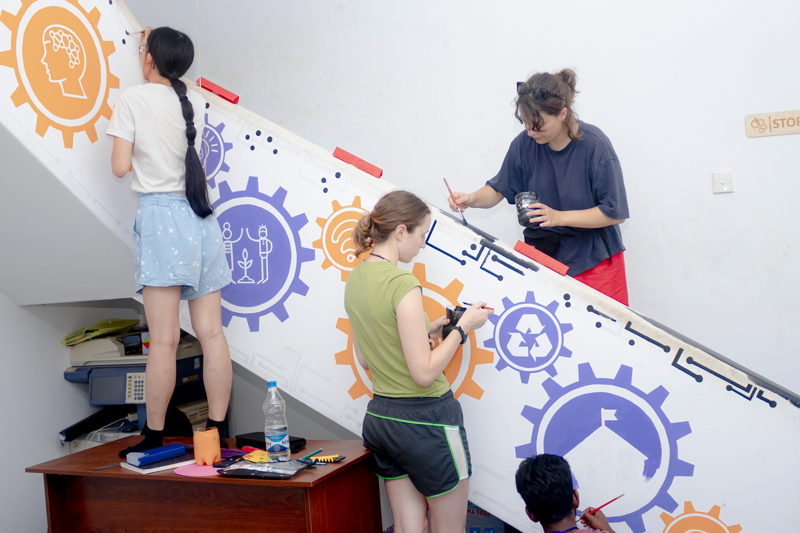 Gutbrod and friends painting a mural