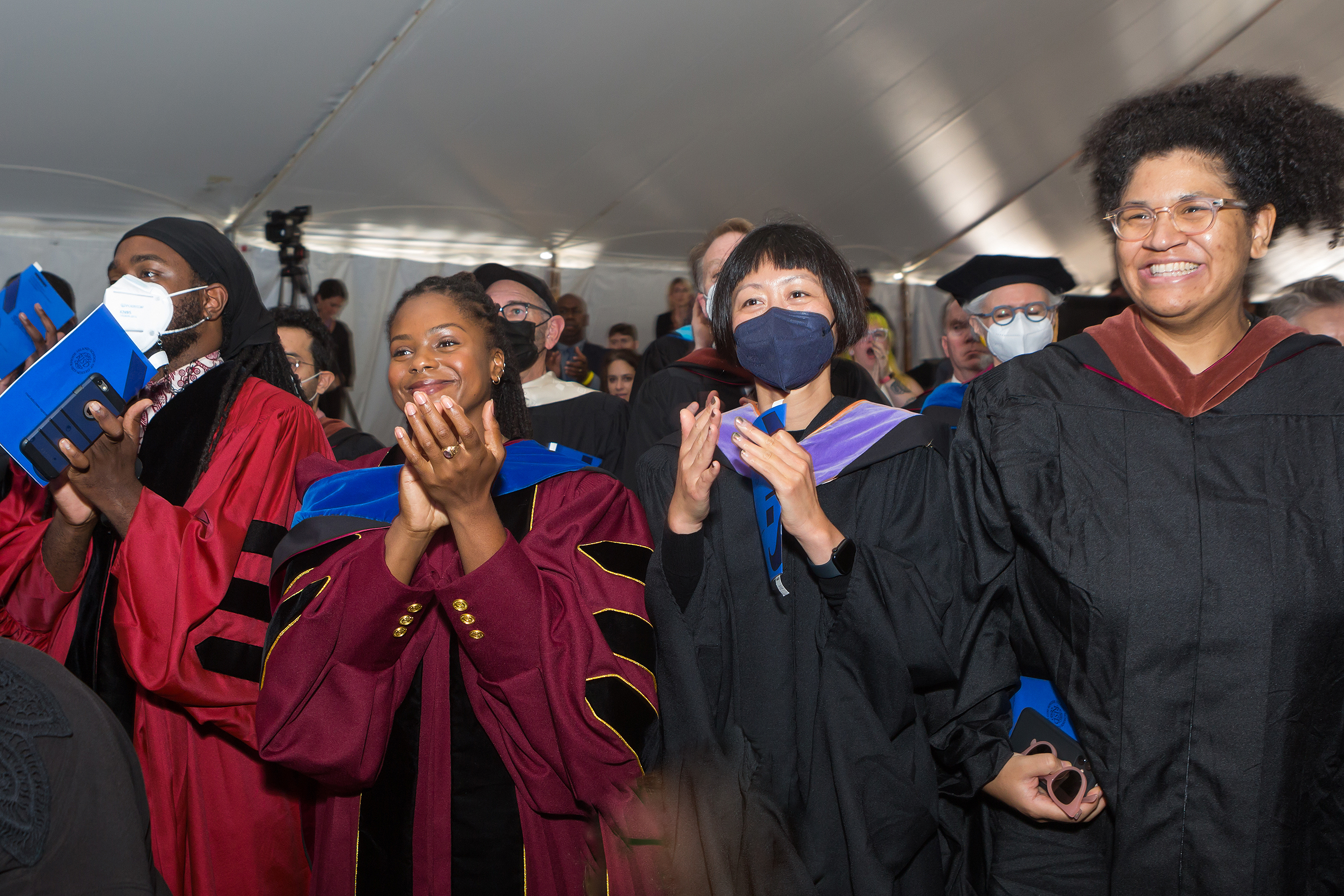 faculty members give Williams a standing ovation