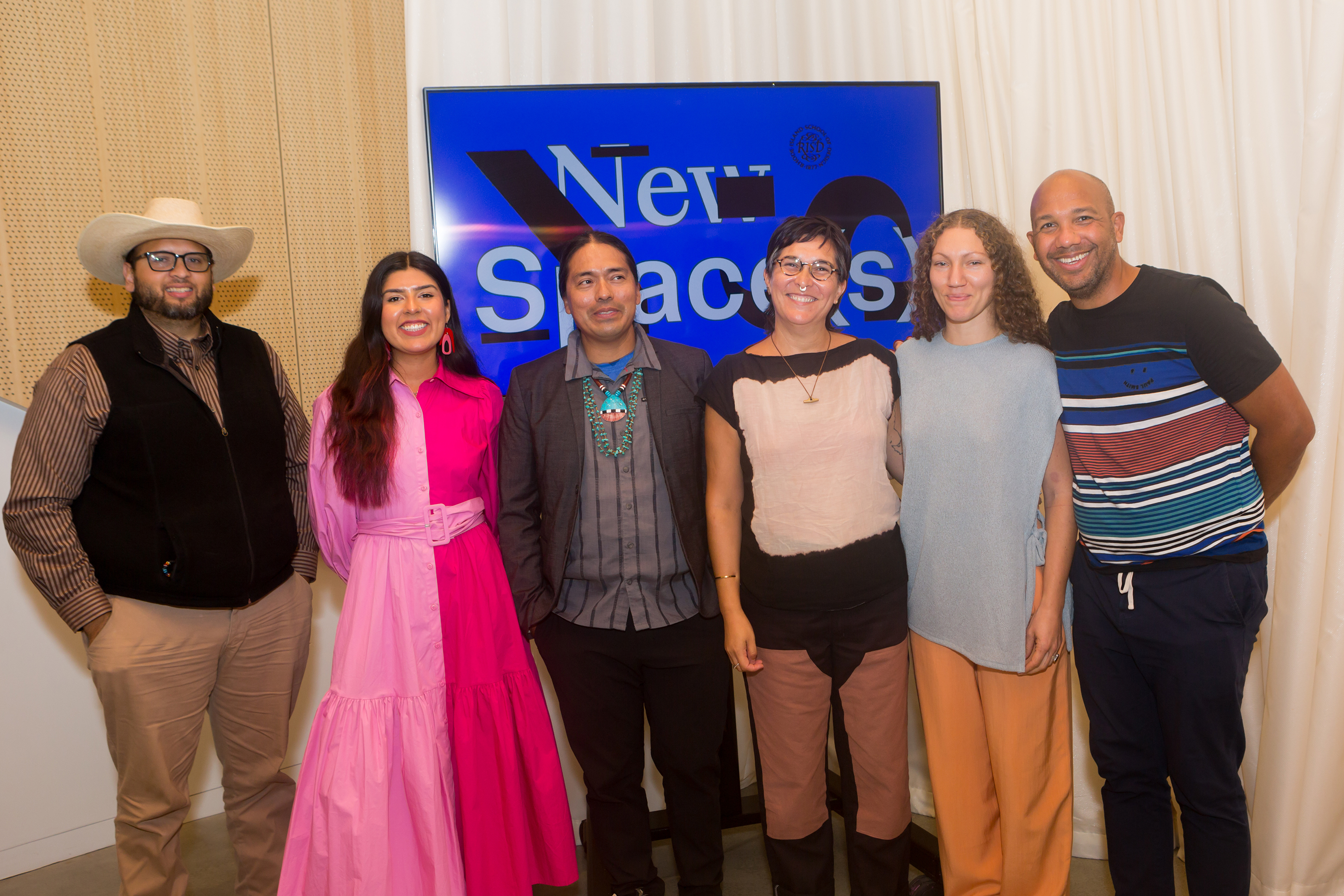 panelists pose for a photo