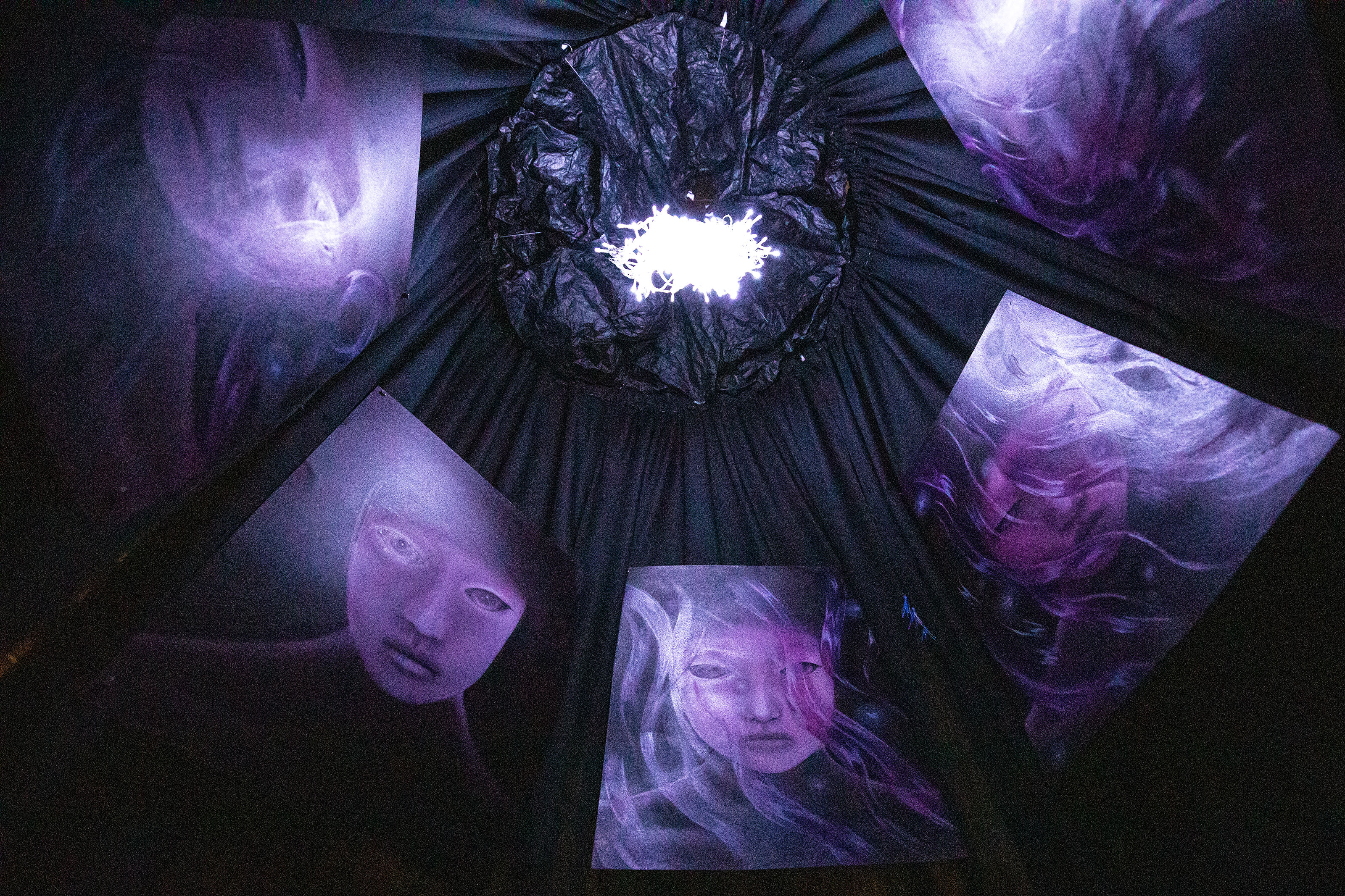 Angie Zhou MFA 24 IL designed an an interactive tent filled with oil paintings that speak to her Mong and Shaman heritage