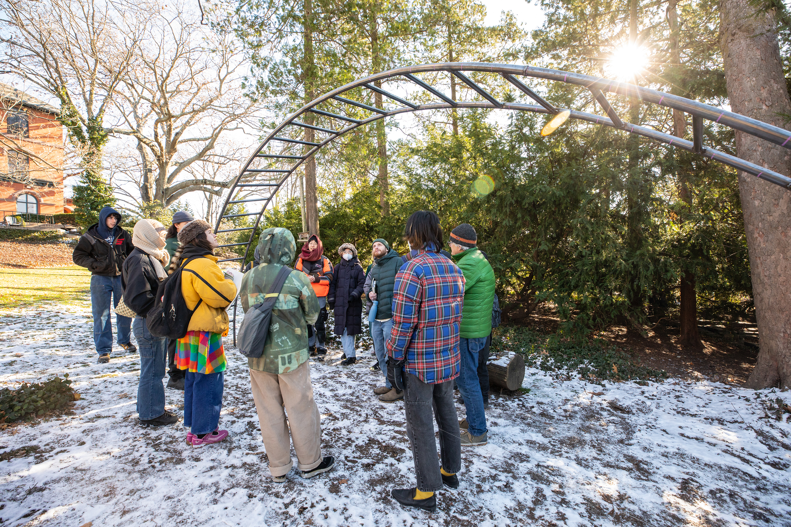 students brave the cold to crit outdoor installation