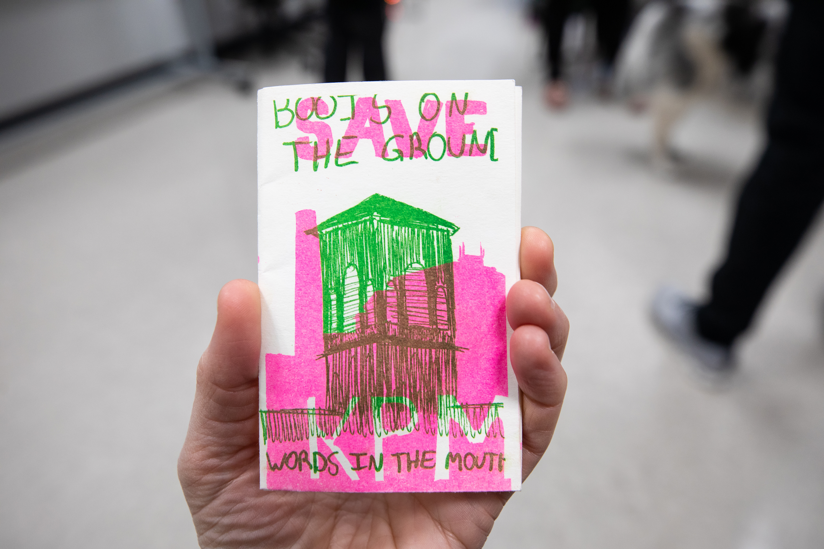 A small booklet printed in a Risograph printer with pink and green overlapping illustrations