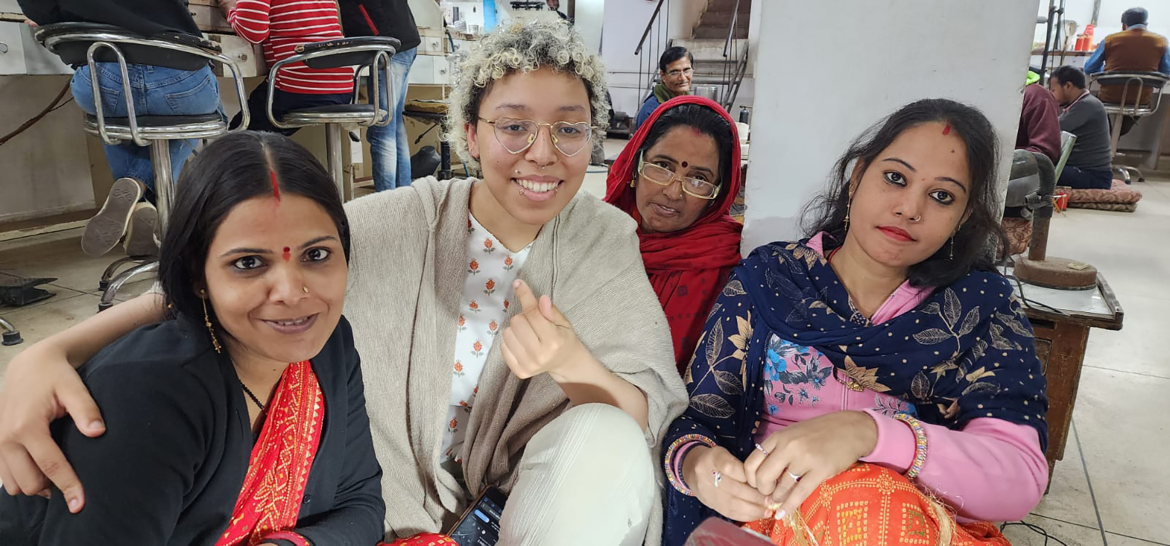 a student embracing her new friends in India