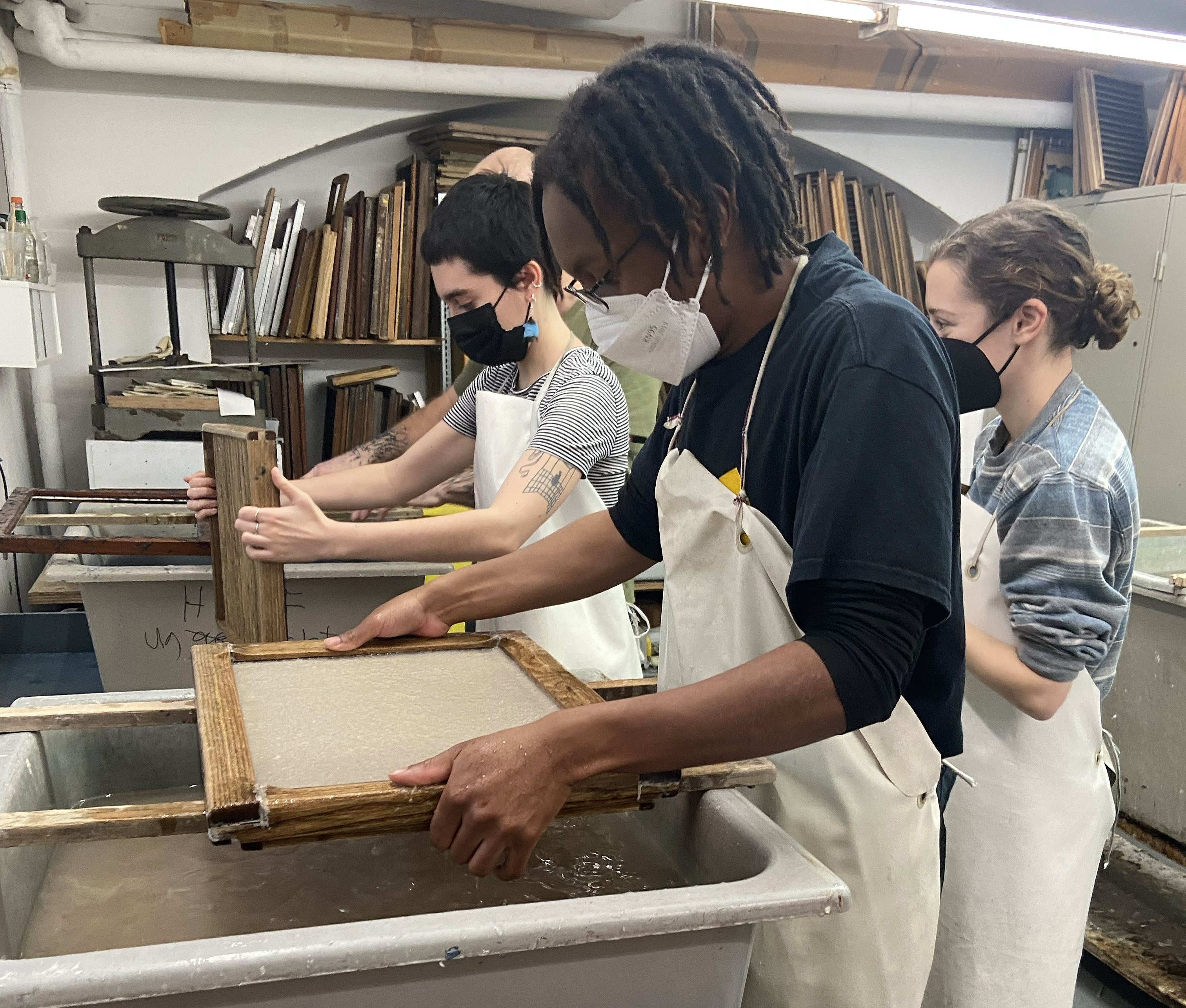 students making paper by hand
