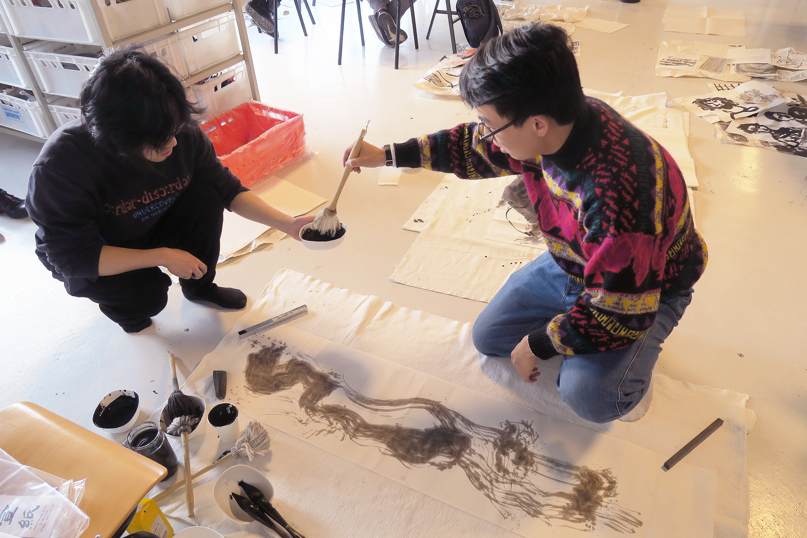 collaborating on a large-format sumi ink drawing
