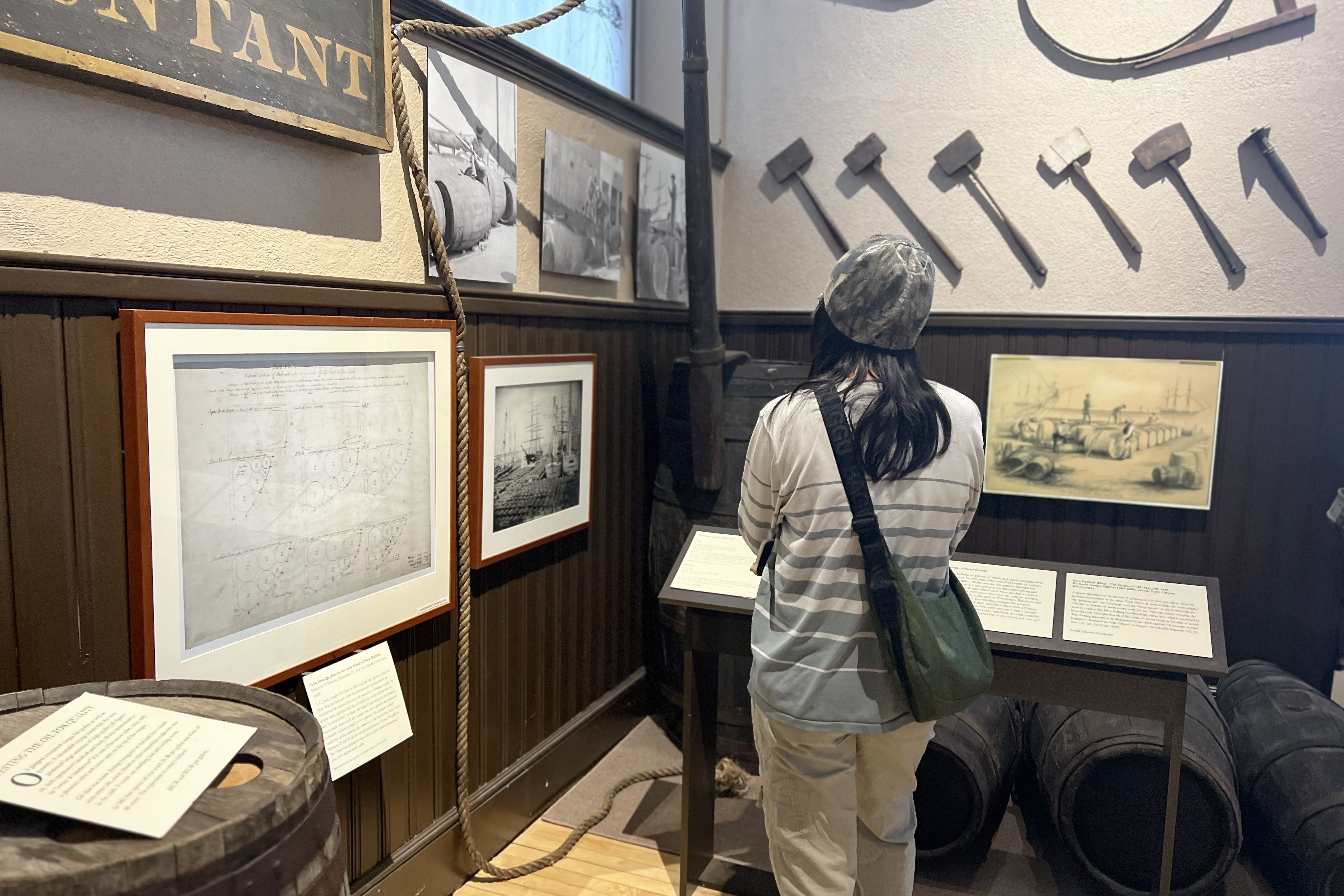 a student takes in an exhibit at the New Bedford Whaling Museum