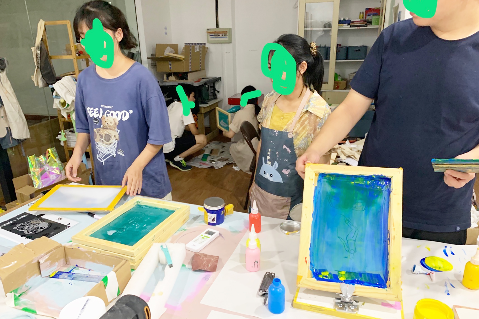 Chinese youth taking part in a printmaking workshop (faces disguised)
