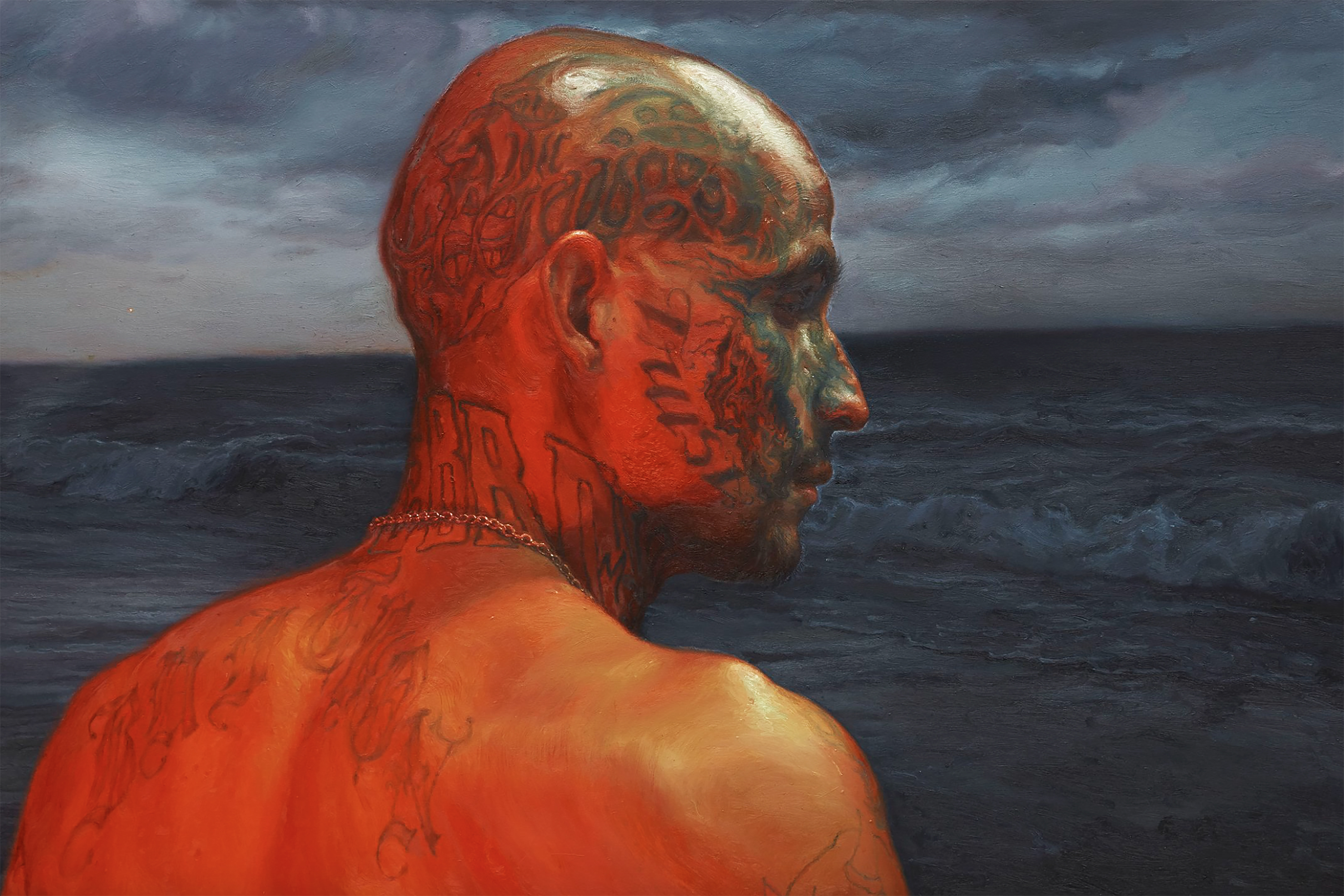 painting of a heavily tattooed man gazing out at the sea