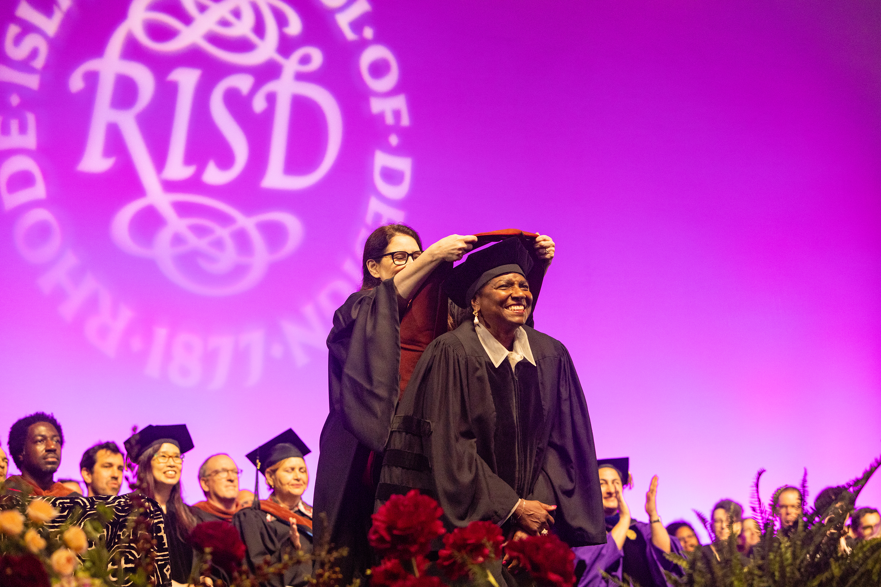 Honorary Degree recipient Maria Magdalena Campos-Pons accepts her hood