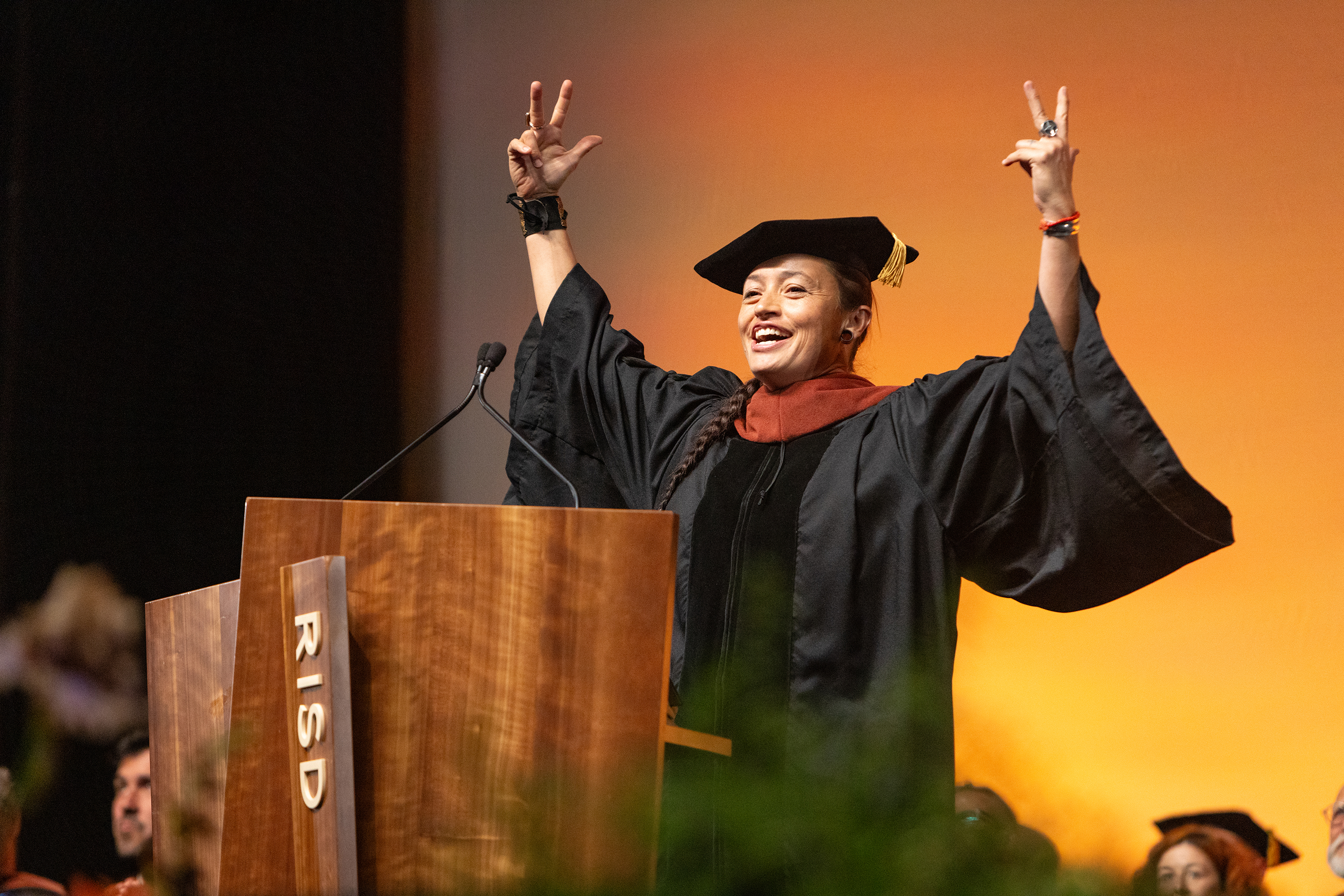 keynote speaker Rose B. Simpson salutes the Class of 2025