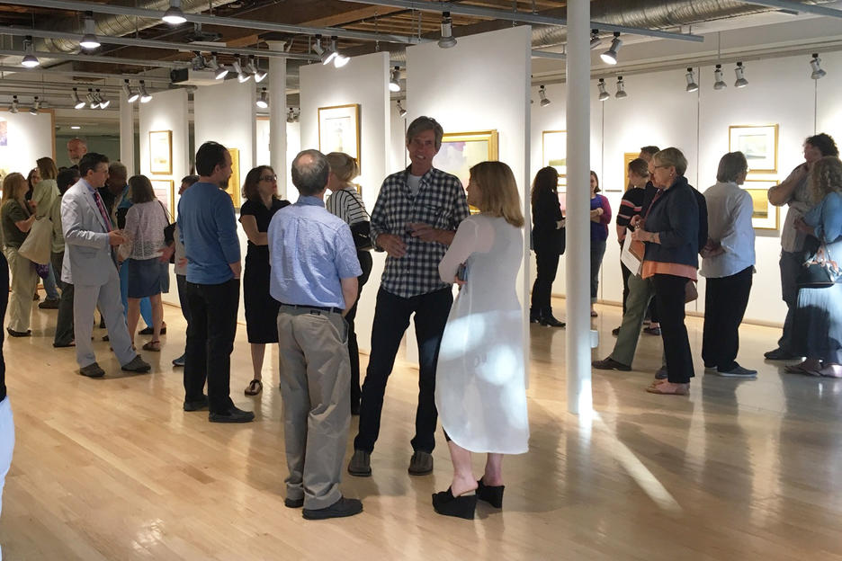 people socializing during an exhibition reception at RISD’s Illustration Studies Building Gallery