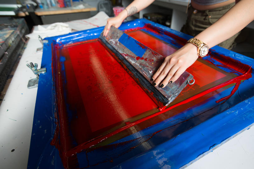 A closeup of a screen-printing process