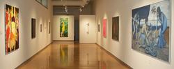 paintings lining exhibition walls on opposite sides of the Sol Koffler Gallery