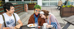 three risd students joyfully eat and hang out at the met cafe