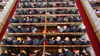 Aerial view of grad students seated for hooding ceremony