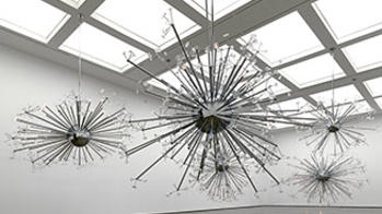 a series of overhead sculptures by Glass alum and past MacArthur winner Josiah McElheny