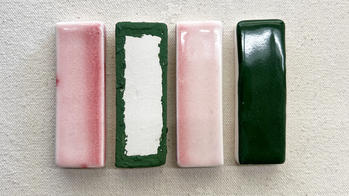 rectangular ceramic samples with pink and green glazes