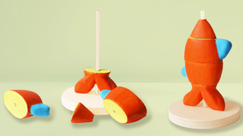 a rendering of toy pieces resembling an orange fish, in different states of assembly