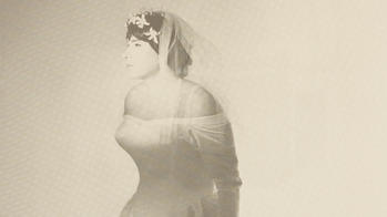 sepia-toned image of a woman in an old-fashioned wedding dress