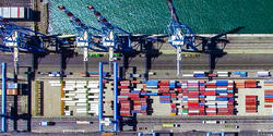Aerial view of shipping containers and cranes