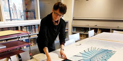 Curator Jan Howard with Forth Estate’s print archive in the RISD Museum