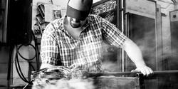 Ben Wright MFA 09 GL working in a hot shop