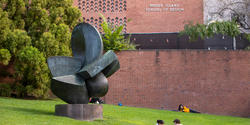 Students sitting/laying on RISD beach in downtown Providence, RI