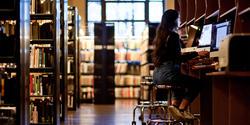 a student watches a video at the Fleet library